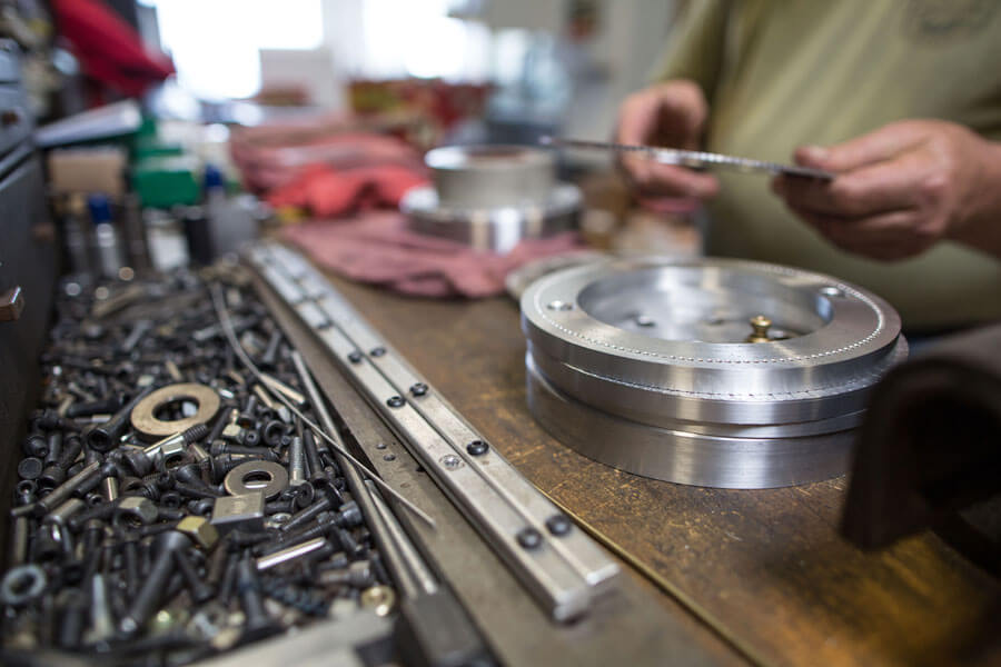 Close up of engineer working with metal components