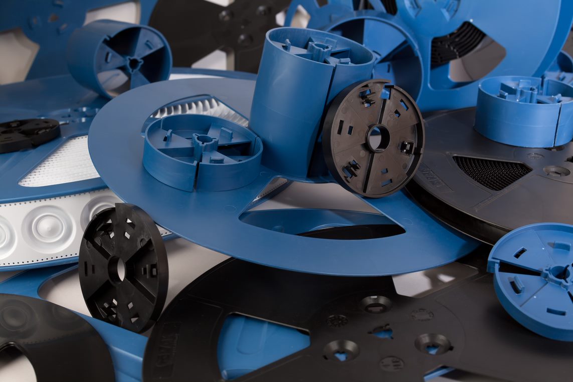 Blue and black thermoformed tape and reels.