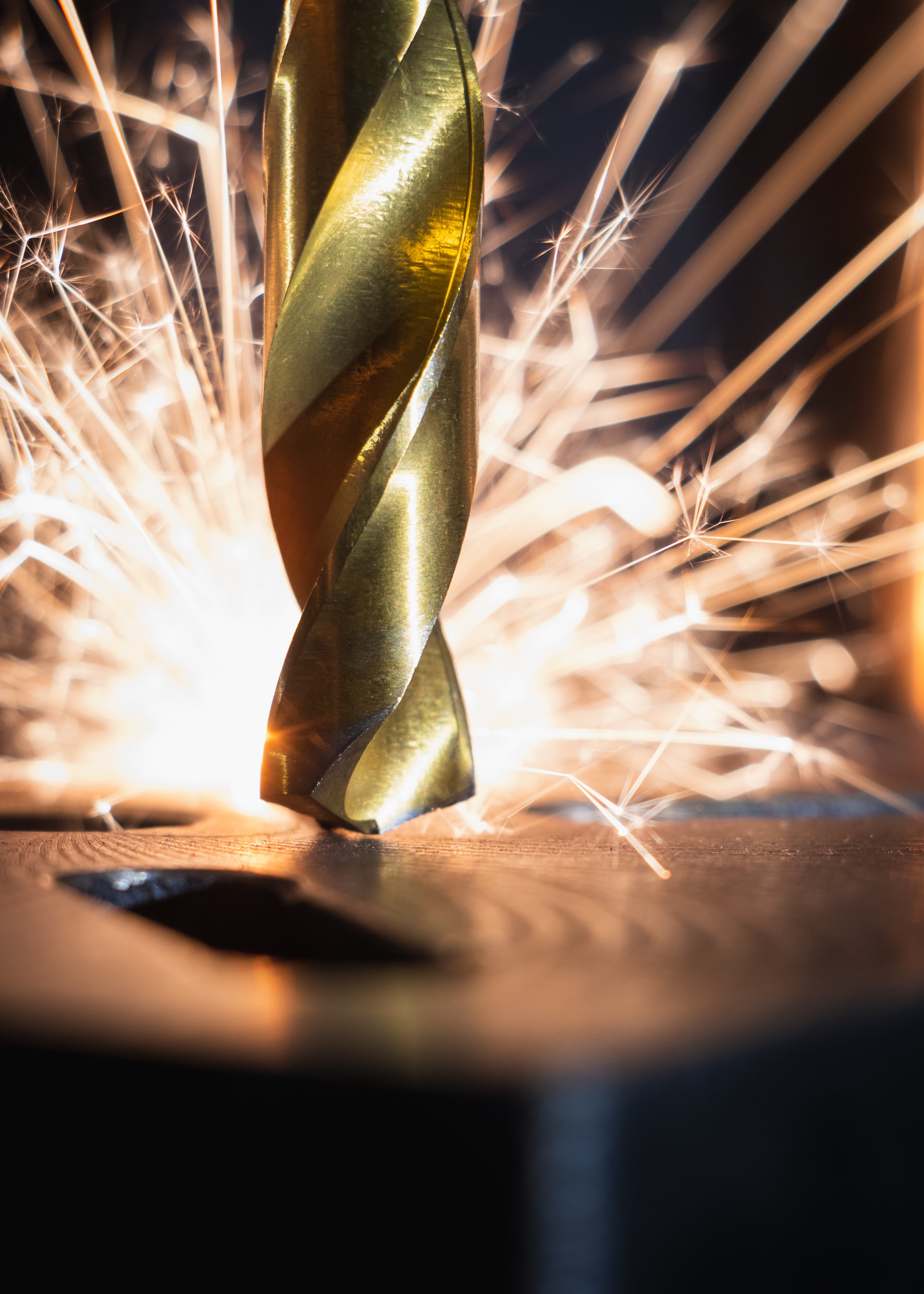 Golden drill bit with metal sparks