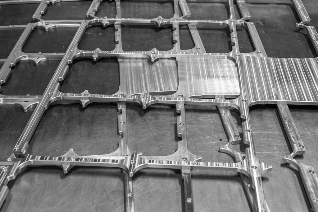 Close up of fiber molded frame work using a metal alloy