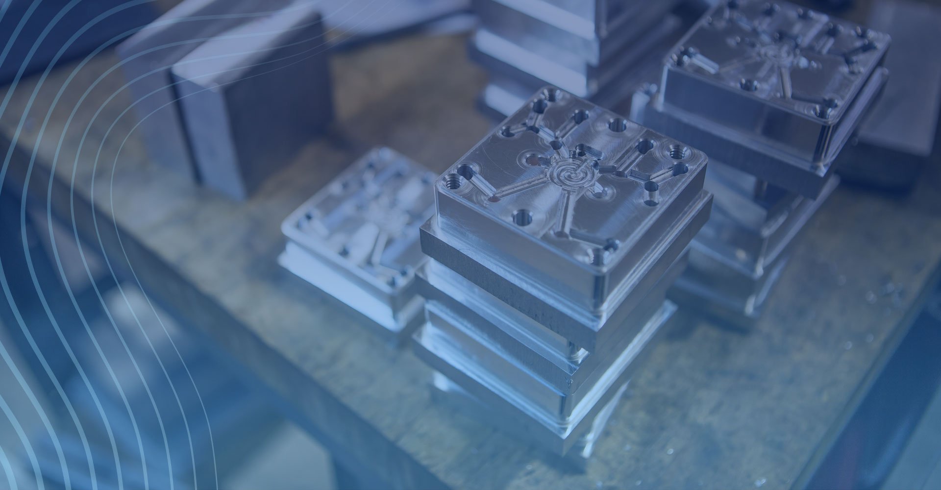 Stacked metal components on a wooden table