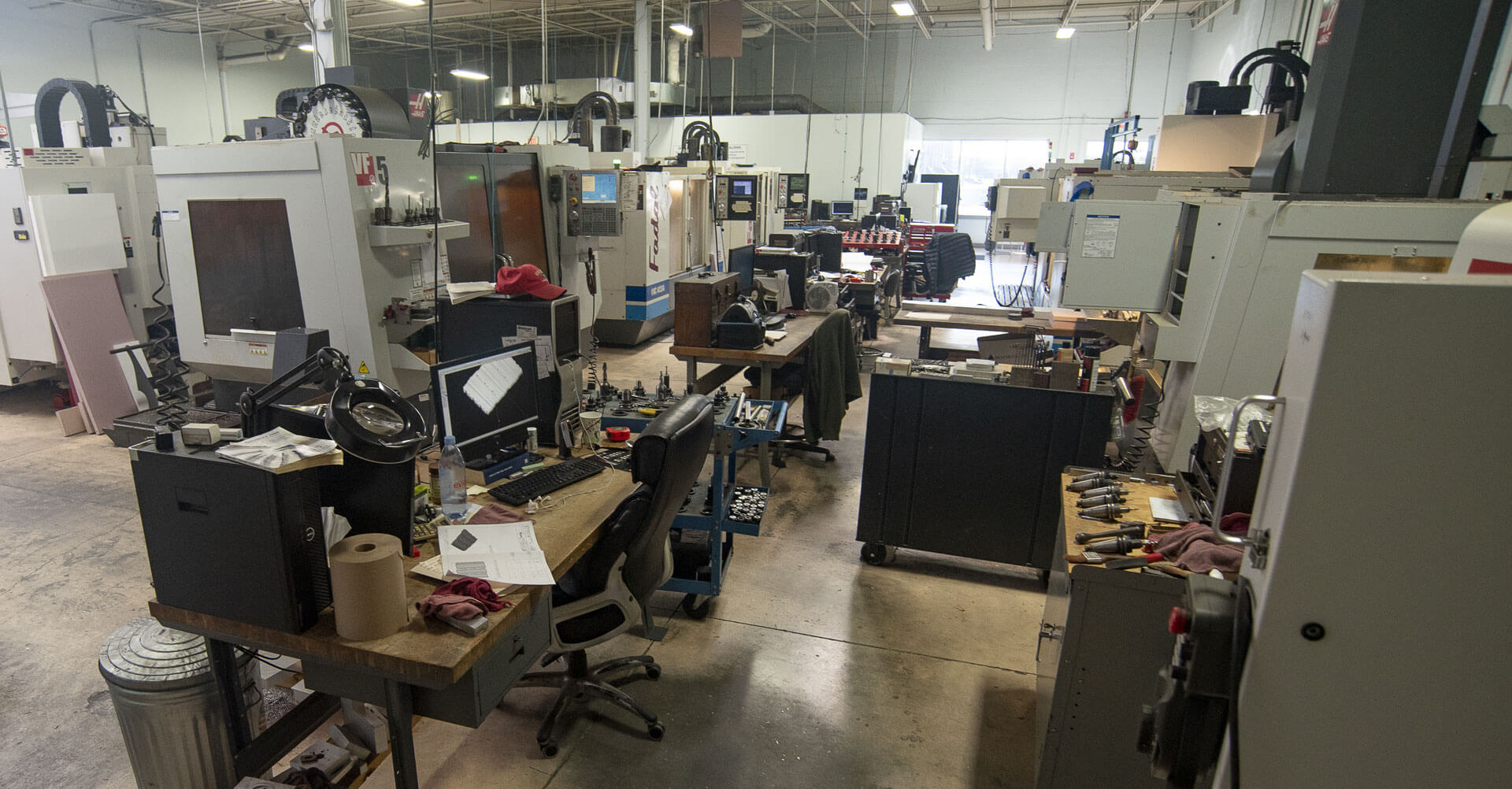 Thermoforming office space with various computers and machines