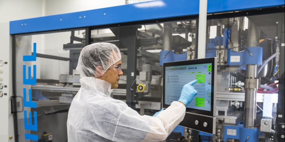 Tek Pak employee works at a Kiefel machine in St. Charles, IL