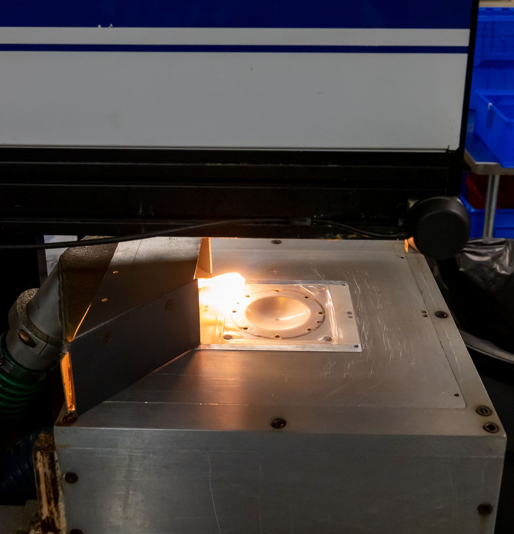 Thermoformed tool being heated and treated through laser trimming